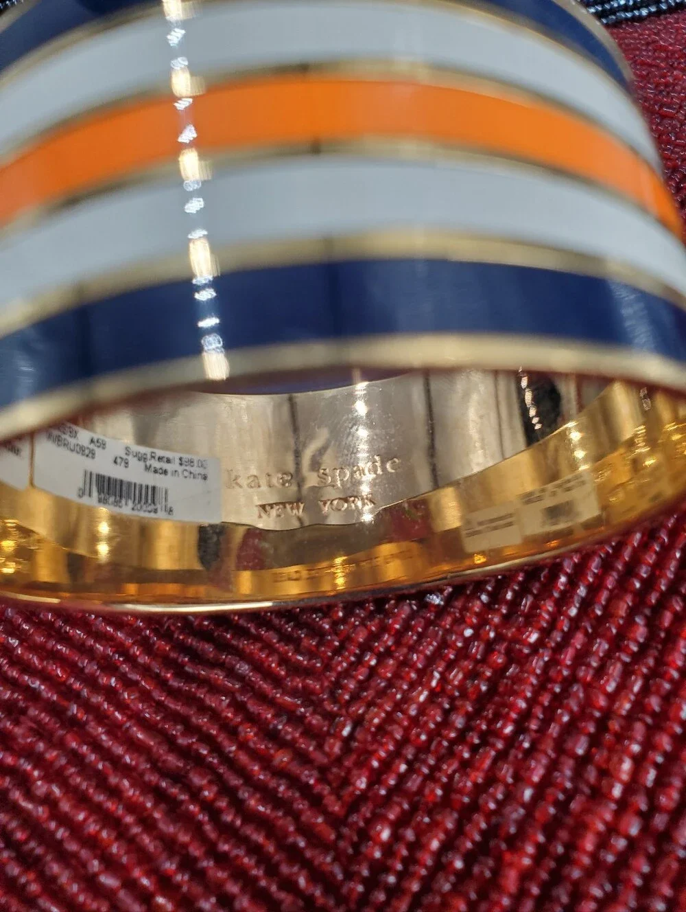 Two vibrant enamel and gold-plated bangle bracelets from Kate Spade New York. - Picture 10 of 17
